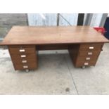 AN OFFICE DESK WITH EIGHT DRAWERS