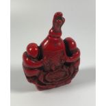 A CHINESE CARVED RED CORAL TYPE SNUFF BOTTLE, HEIGHT 7.5CM