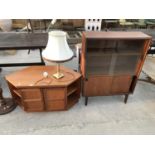 A TEAK TV CABINET, A TEAK CABINET WITH FOUR SLIDING DOORS AND A BRASS TABLE LAMP