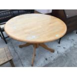 A CIRCULAR BEECH DINING TABLE WITH PARQUET TOP