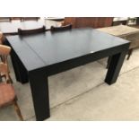 A MODERN BLACK BLACK DINING TABLE ON SHAPED SUPPORTS 183 CM X 90 CM X 78 CM HIGH
