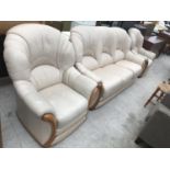 A MAHOGANY AND CREAM LEATHER THREE PIECE SUITE