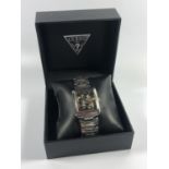 A GENTS BOXED 'GUESS' STAINLESS STEEL TANK STYLE WATCH