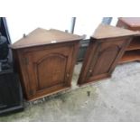 TWO MATCHING OAK FLAT FRONT CORNER CUPBOARDS