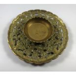 AN ORIENTAL DESIGN BRASS ASHTRAY, MARKS TO BASE, WIDTH 17CM