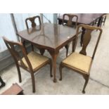 A MAHOGANY DRAW LEAF DINING TABLE ON CABRIOLE SUPPORTS AND FOUR MATCHING DINING CHAIRS