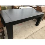 A MODERN BLACK BLACK DINING TABLE ON SHAPED SUPPORTS 152 CM X 90 CM X 78 CM HIGH
