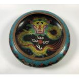 AN EARLY 20TH CENTURY CHINESE CLOISONNÉ CIRCULAR BOWL WITH INTERIOR DRAGON CHASING THE FLAMING PEARL