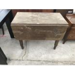 AN OAK DROP LEAF TABLE