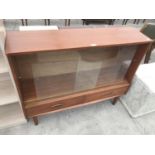 A SUTCLIFFE TEAK SIDEBOARD WITH TWO SLIDING GLASS DOORS AND TWO DRAWERS