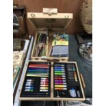 A WOODEN ARTISTS EASEL BOX AND FURTHER BOX OF ART SUPPLIES (QTY)