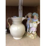 A CLARICE CLIFF MATT GLAZE JUG AND CONTINENTAL BISQUE STYLE FIGURE (2)