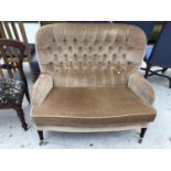 A PARKER KNOLL BUTTON BACK TWO SEATER SOFA