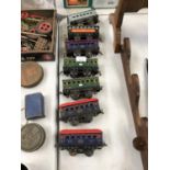 SEVEN ASSORTED VINTAGE TINPLATE MODEL RAILWAY CARRIAGES