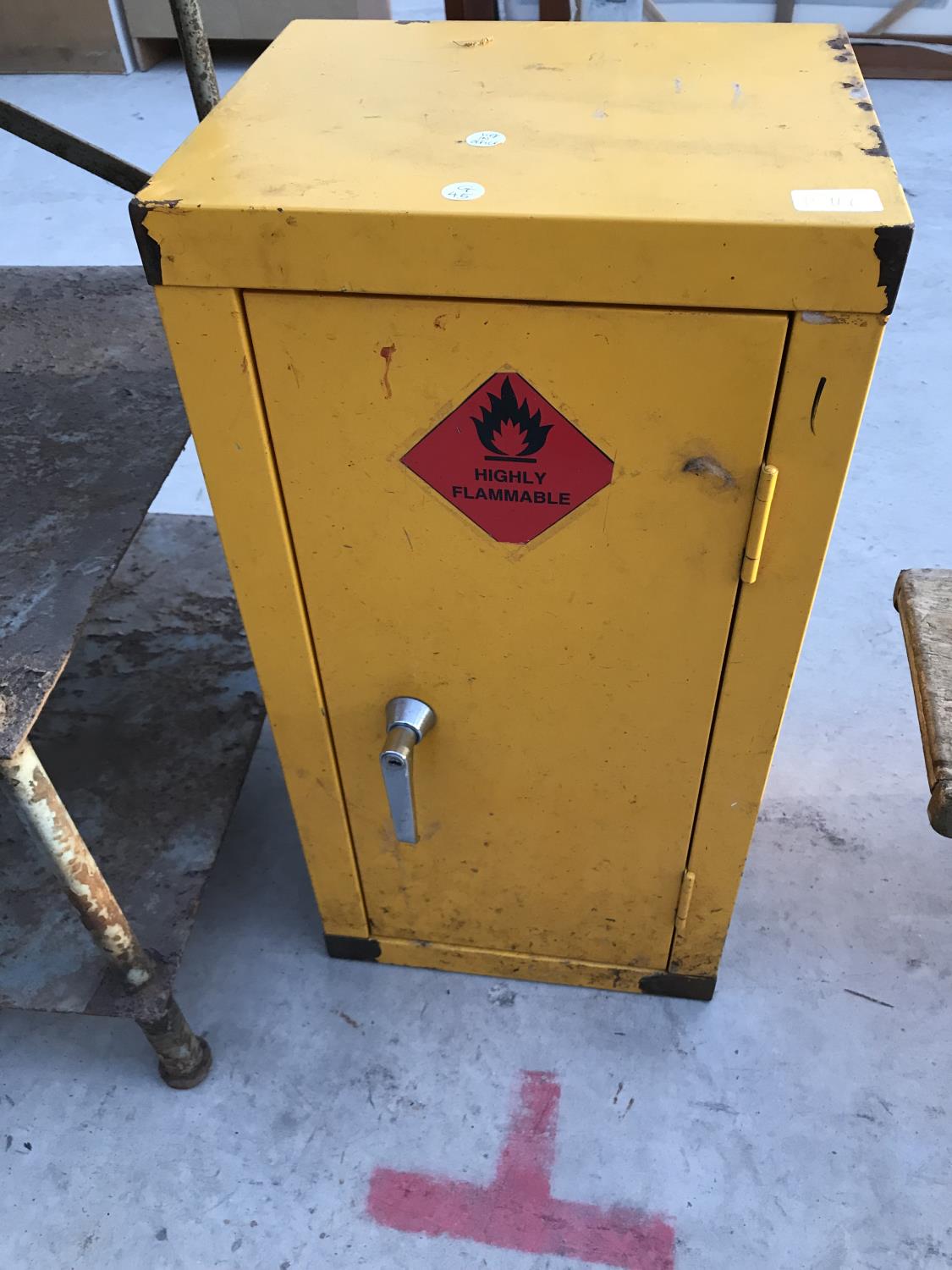 A YELLOW METAL CABINET WITH LOCK 36CM X 30CM X 71CM HIGH (KEY IN OFFICE)