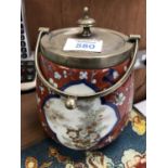 A CHINESE CERAMIC BISCUIT BARREL WITH SILVER PLATED LID AND HANDLE