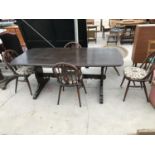 AN ERCOL ELM REFECTORY TABLE AND FOUR ERCOL ELM DINING CHAIRS