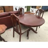 A MAHOGANY DINING TABLE AND THREE CHAIRS