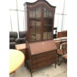 A MAHOGANY BUREAU BOOKCASE ON CABRIOLE SUPPORTS WITH FALL FRONT, THREE DRAWERS AND TWO UPPER