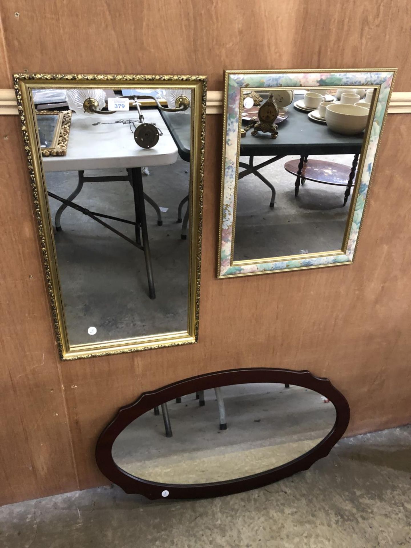 A GROUP OF THREE FRAMED MIRRORS