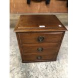 A MAHOGANY SMALL CHEST OF THREE DRAWERS FROM A DRESSING TABLE TOP