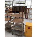 A VINTAGE INDUSTRIAL SHELF UNIT WITH FIVE SHELVES AND VARIOUS HOOKS 61CM X 61CM X 195CM