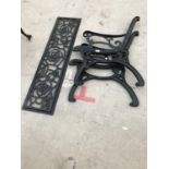 A PAIR OF BLACK PAINTED CAST IRON BENCH ENDS AND AN ORNATE BACK PANEL 116CM X 30CM