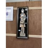 A DECORATIVE FRAMED TILE PICTURE OF A MEDIEVAL GUARD