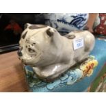 A YUAN DYNASTY STYLE POTTERY CIZHOU CAT PILLOW FIGURE