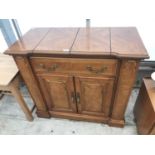 A CHERRY WOOD SIDEBOARD WITH ONE DRAWER, TWO DOORS AND FOLDING SERVER TOP