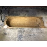 A VINTAGE WOODEN TEAK FEEDING TROUGH