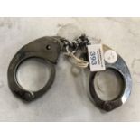 A PAIR OF 1960'S POLICE HAND CUFFS