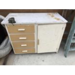A RETRO KITCHEN CABINET WITH FOUR DRAWERS AND ONE DOOR AND A WH COLT ENGINEERS WILSON VICE LONDON