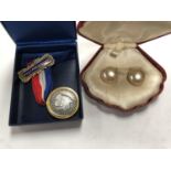 A SILVER TOPPED MEDAL AND BOXED PEARL EARRINGS (2)