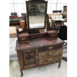 A MAHOGANY AND PINE DRESSING TABLE WITH ONE DOOR, THREE DRAWERS, TWO SMALL UPPER DRAWERS AND BEVEL