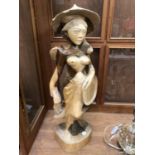 A DECORATIVE WOODEN FIGURE OF A LADY