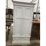 A WHITE PAINTED SOLID PINE WARDROBE WITH TWO DOORS AND ONE DRAWER