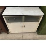 A VINTAGE WHITE KITCHEN CABINET WITH TWO SLIDING GLASS DOORS, TWO FURTHER DOORS AND FORMICA TOP