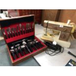 A 'SINGER' ELECTRIC SEWING MACHINE WITH CASED CUTLERY SET (2)