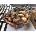 A POTTERY MODEL OF A FRUIT BASKET