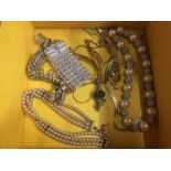 A BOX OF ASSORTED YELLOW METAL COSTUME JEWELLERY