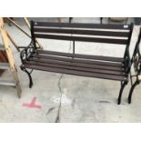 A WOODEN BENCH WITH CAST IRON BENCH ENDS