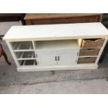 A WHITE SIDEBOARD WITH THREE BASKET DRAWERS