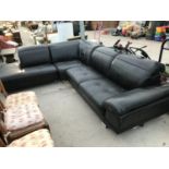 A BLACK LEATHER CORNER SUITE