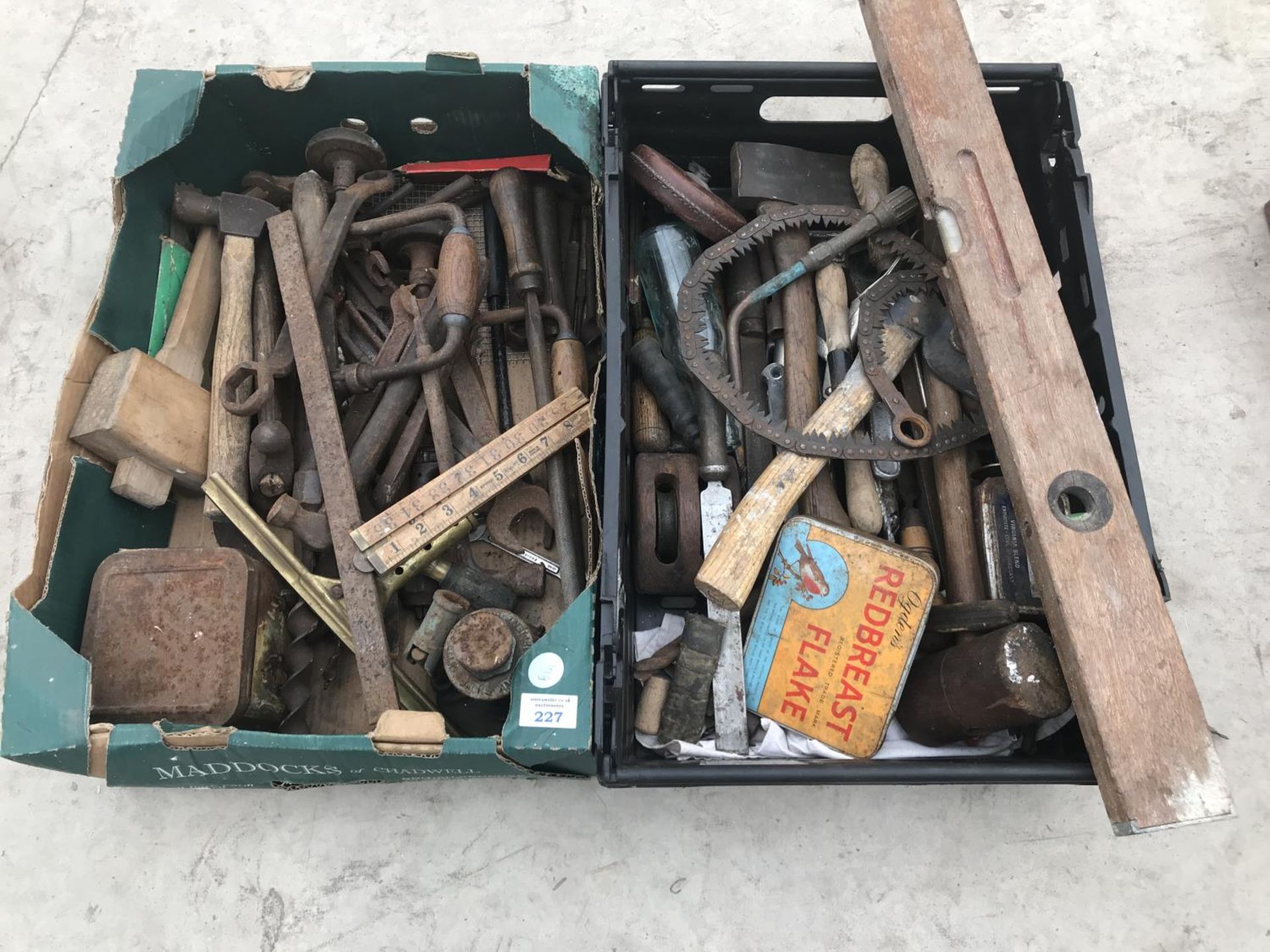TWO BOXES OF VINTAGE ITEMS TO INCLUDE SPIRIT LEVEL, AXE, HAMMER, TAPE MEASURE, BOTTLE JACK, DRILL