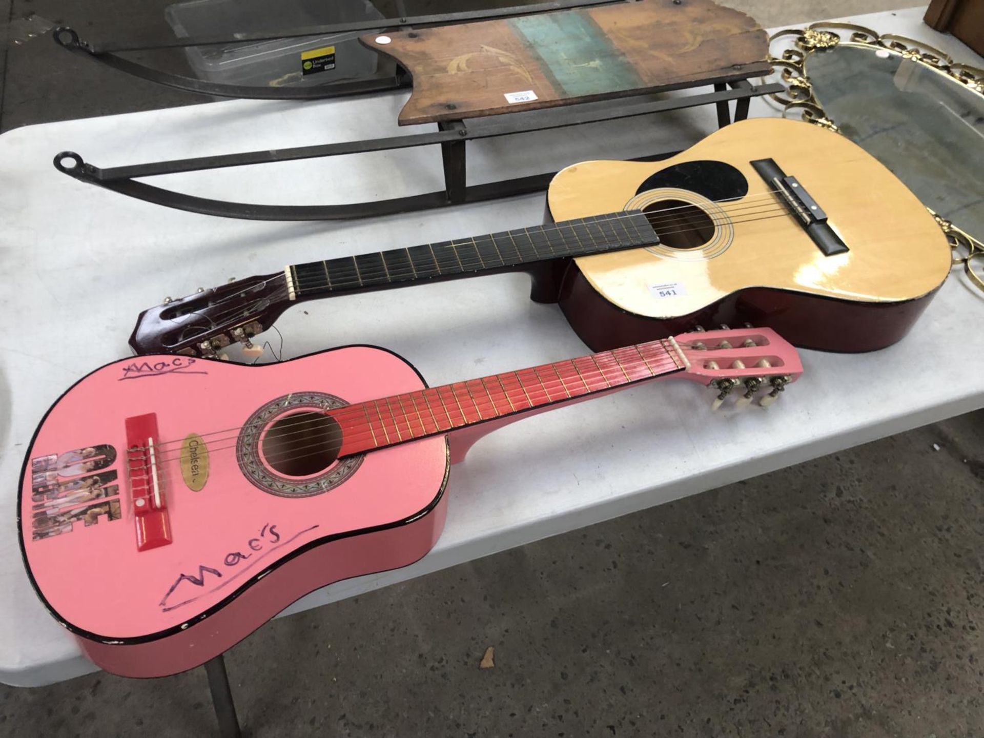 TWO GUITARS TO INCLUDE A PINK CHILD'S EXAMPLE