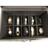 A WATCH DISPLAY CASE CONTAINING TEN ASSORTED LADIES WATCHES