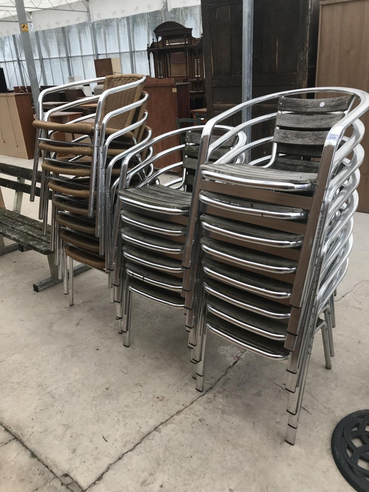 TWENTY TWO CHROME BISTRO CHAIRS SOME WITH WOOD AND SOME WITH WOVEN PLASTIC SEATS