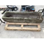 A LARGE STONE TROUGH 133CM X 36CM