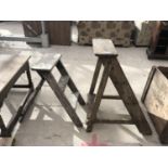 A THREE RUNG WOODEN STEP FRAME, A TWO RUNG WOODEN STEP LADDER, AND A WOODEN TABLE